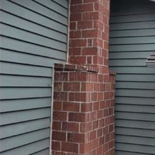 Painted brick chimney, after blasting