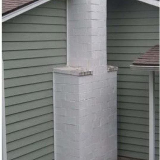 Painted brick chimney, before blasting